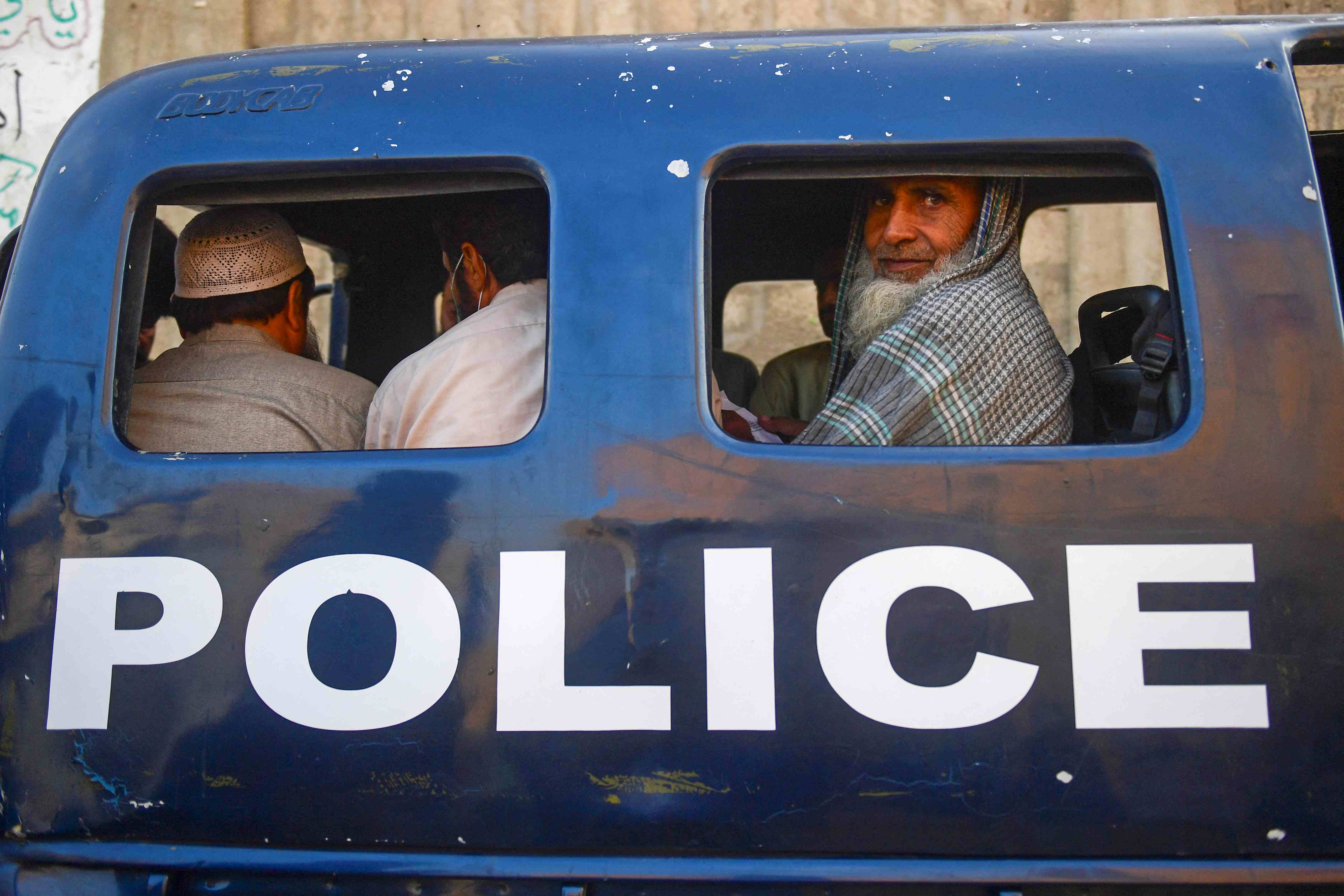 Afghan refugees police van.jpg